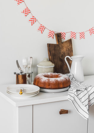 A simple pound cake for a holiday, tea party, dessert on a white tableの写真素材