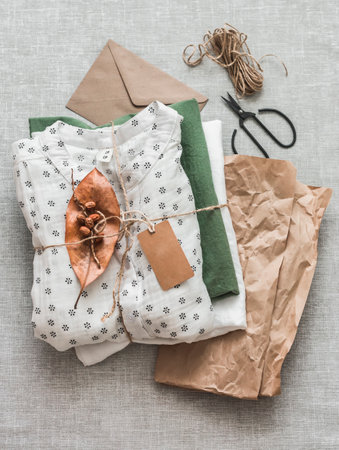 customer-oriented concept. With love and care eco friendly packaging of women's clothing on a light background, top viewの写真素材