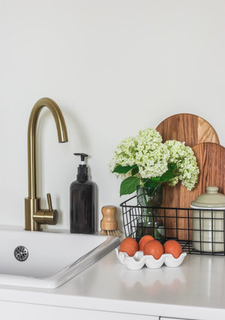 Kitchen morning view - cutting wooden boards, a bouquet of hydrangeas in a basket, eggs in a ceramic...