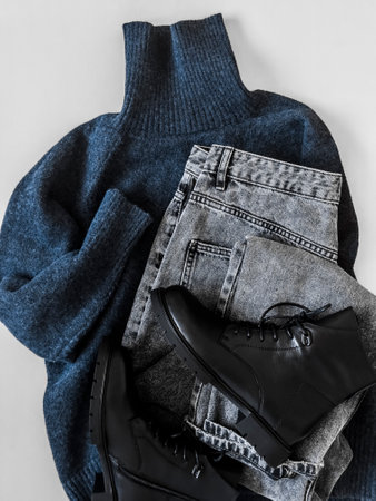 Warm blue cashmere sweater, gray jeans, black leather shoes - comfortable casual women's clothing on...