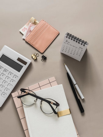 Planning, accounting of income expenses. Business finance concept. Accessories - planner, calculator, calendar on a light background, top viewの写真素材