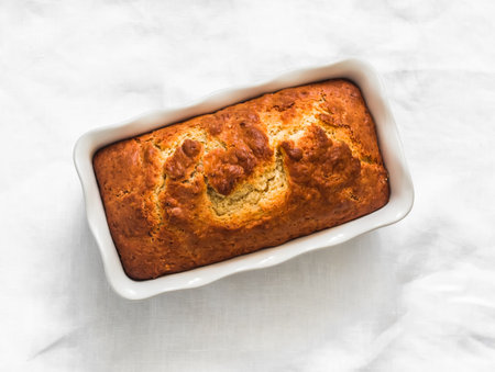 Ricotta lemon pound cake in a baking dish on a light background top viewの写真素材