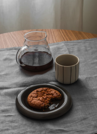 Coffee break - black coffee and peanut butter cookies on the tableの写真素材