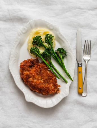 Chicken, mashed potatoes, grilled broccoli on a light background, top viewの写真素材