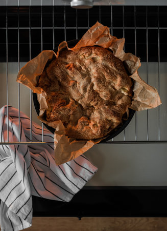 Apple charlotte pie in a baking dish in the oven