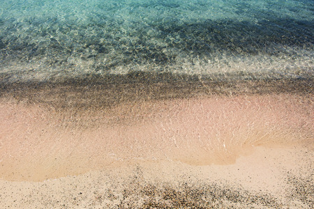 Wet sand washed by sea tide background の写真素材