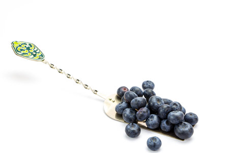 Fresh ripe blueberries on cake spatula isolatedの写真素材