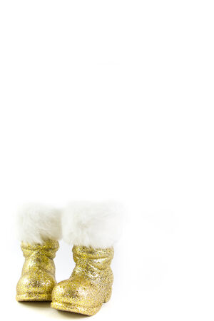 Santas golden boots isolated on whiteの写真素材