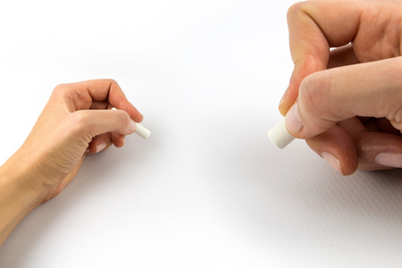 Hand holding chalk, set isolated on black background