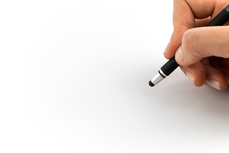 Hand holding digital stylus isolated on white backgroundの写真素材