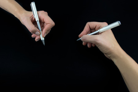 Hand holding pencil, set isolated on black backgroundの写真素材
