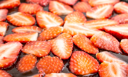 Strawberries in jam closeup backgroundの写真素材