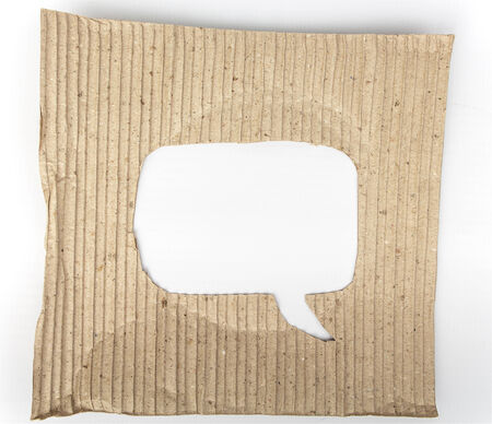 Old cardboard paper with speech bubble hole in the middle