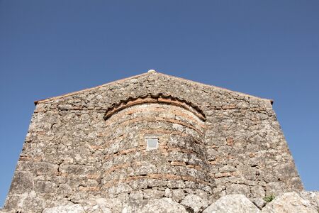 Stone byzantine building on blue sky with copy-space.の写真素材
