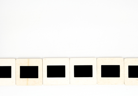 Old paper photo slides, isolated on white background.の写真素材