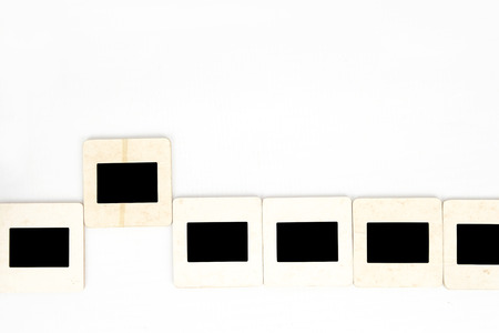 Old paper photo slides, isolated on white background.の写真素材