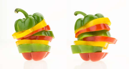 Two bell peppers sliced into colorful rings, isolated on white background.の写真素材