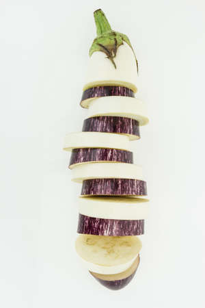 Fresh mix sliced purple and white eggplant in one , isolated on white backgroundの写真素材