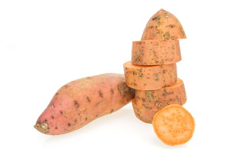 Fresh sweet potatoes whole and sliced , isolated on white backgroundの写真素材