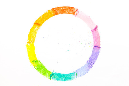 Circle drawn with colorful pastel chalks, on white backgroundの写真素材