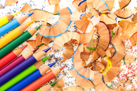 Bunch of colorful pencils, on a pile of colorful pencil shavingsの写真素材