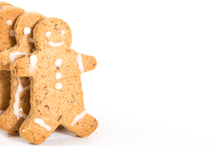 Gingerbread men cookies, on white background with copy-space.の写真素材