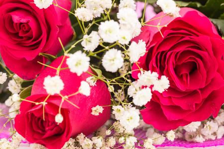 Closeup of red roses bouquet with white flowersの写真素材