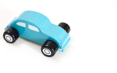 A blue toy car, on white background with copy-space.の写真素材