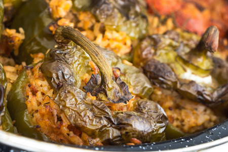 Stuffed green bell peepers in dish, closeup background.の写真素材
