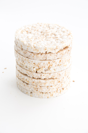 Round rice cakes/ crackers, on white background.の写真素材