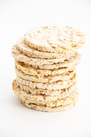 Round corn cakes/ crackers, on white background.の写真素材