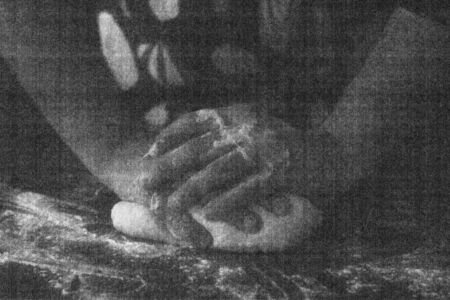 Male hands kneading closeup, black and white noisy and grainy effect.の写真素材