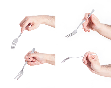 Hand holding fork, on white background.