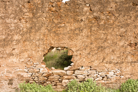Old stone wall with hole, background/ texture.の写真素材