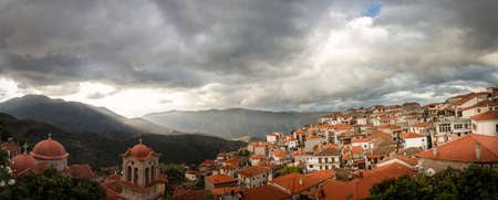 Scenic town with traditional ceramic tile rooftops surrounded by mountains, Arachova Boeotia Greece.のeditorial素材