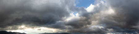 Moody cloudscape, panoramic background with copy-space.の写真素材