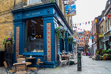 LONDON, UK -  April, 13:  Exterior of pub, for drinking and socializing  with oriental ornaments. Typical London streetのeditorial素材