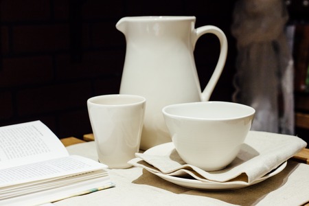 breakfast composition with the book and white serviceの写真素材