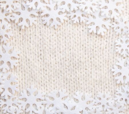 Woven wool white fabric texture with snowflakes aroundの写真素材