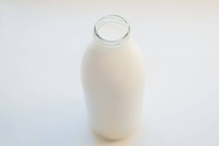 glass bottle full of milkの写真素材