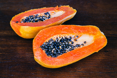 Papaya fruit on wooden background.の写真素材