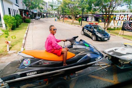 Thailand, Phuket - 19 February 2017 : Typical scene of life on the street in Thailand. Transportation Water scooter on the roadのeditorial素材