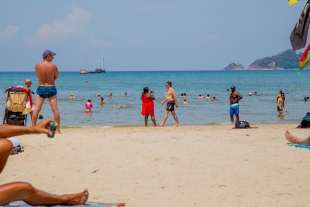 Thailand, Phuket - 19 February 2017 : Patong beach. people sunbathe and swim at the beachのeditorial素材