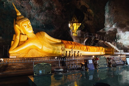 Thailand, Phuket - 19 February 2017 : Wat Tham Suwan Khuha cave. The golden reclining Buddha is a tourist attraction in Phang Ngaのeditorial素材