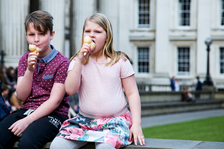 UK, London - April 08, 2015: Children eat ice creamのeditorial素材