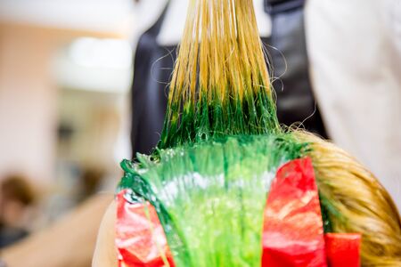 Professional hairdresser dyeing hair. Multicolor Fluorescent stainingの写真素材