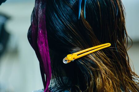 Professional hairdresser dyeing hair. Multicolorの写真素材