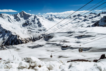Snowy mountains. Beautiful landscape with snowy rocks. View from the top of Mount Elbrusの写真素材