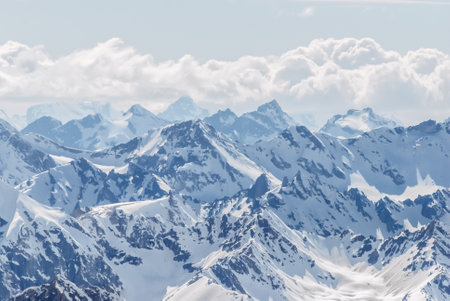 Snow-covered winter mountains of the Caucasus on a sunny day. Panoramic view from the ski slope of Elbrusの写真素材