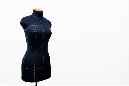 Black women sewing mannequin with main marks for removing of measures standing on a white backgroundの写真素材
